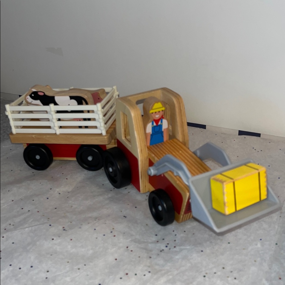 Melissa and Doug… wooden play set, wagon will unhitch from tractor. - Picture 3 of 3